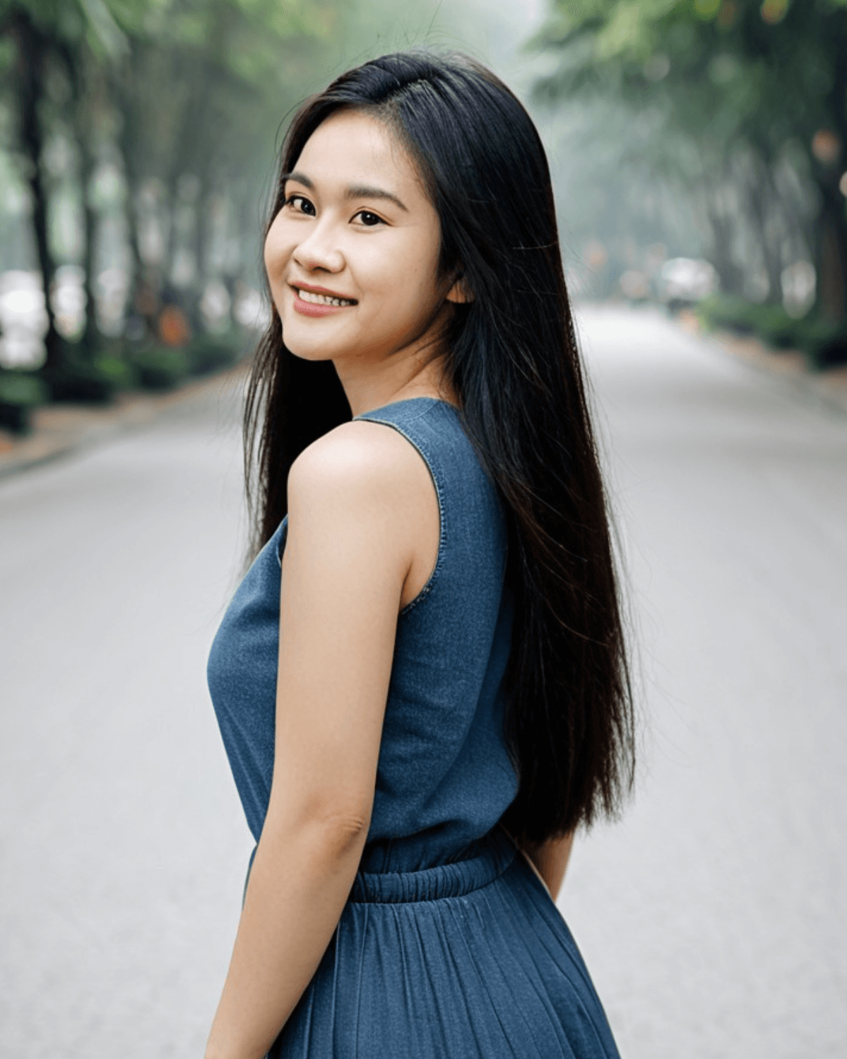 Vietnamese woman outdoors with an over-the-shoulder glance